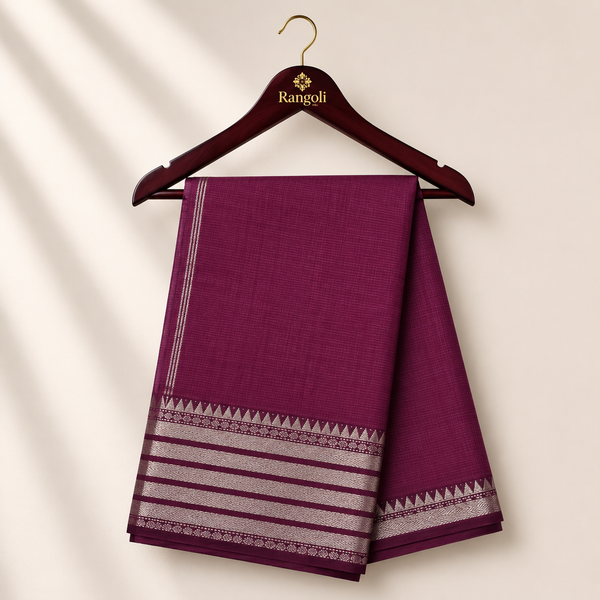 Elegant wine purple silk saree featuring fine woven stripes with a sophisticated silver zari border for a timeless ethnic look.