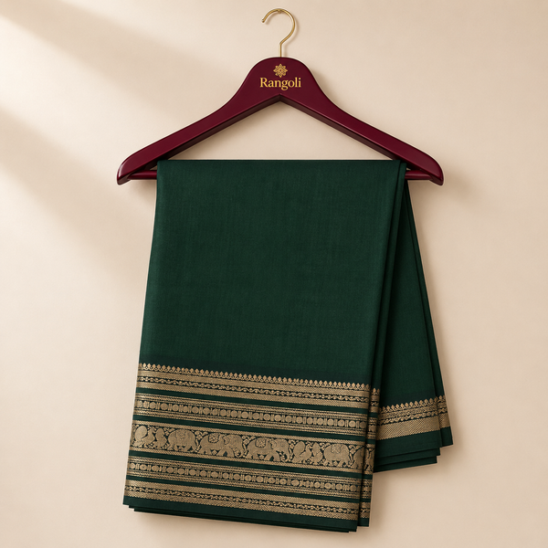 Elegant bottle green saree featuring a richly woven gold zari border with traditional elephant motifs for a regal and timeless ethnic look.