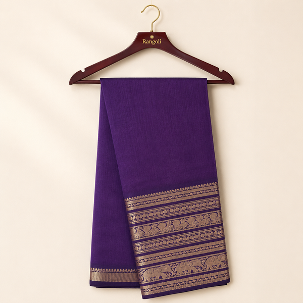 Elegant deep purple silk saree featuring a rich traditional gold zari woven border for a timeless and graceful ethnic look.