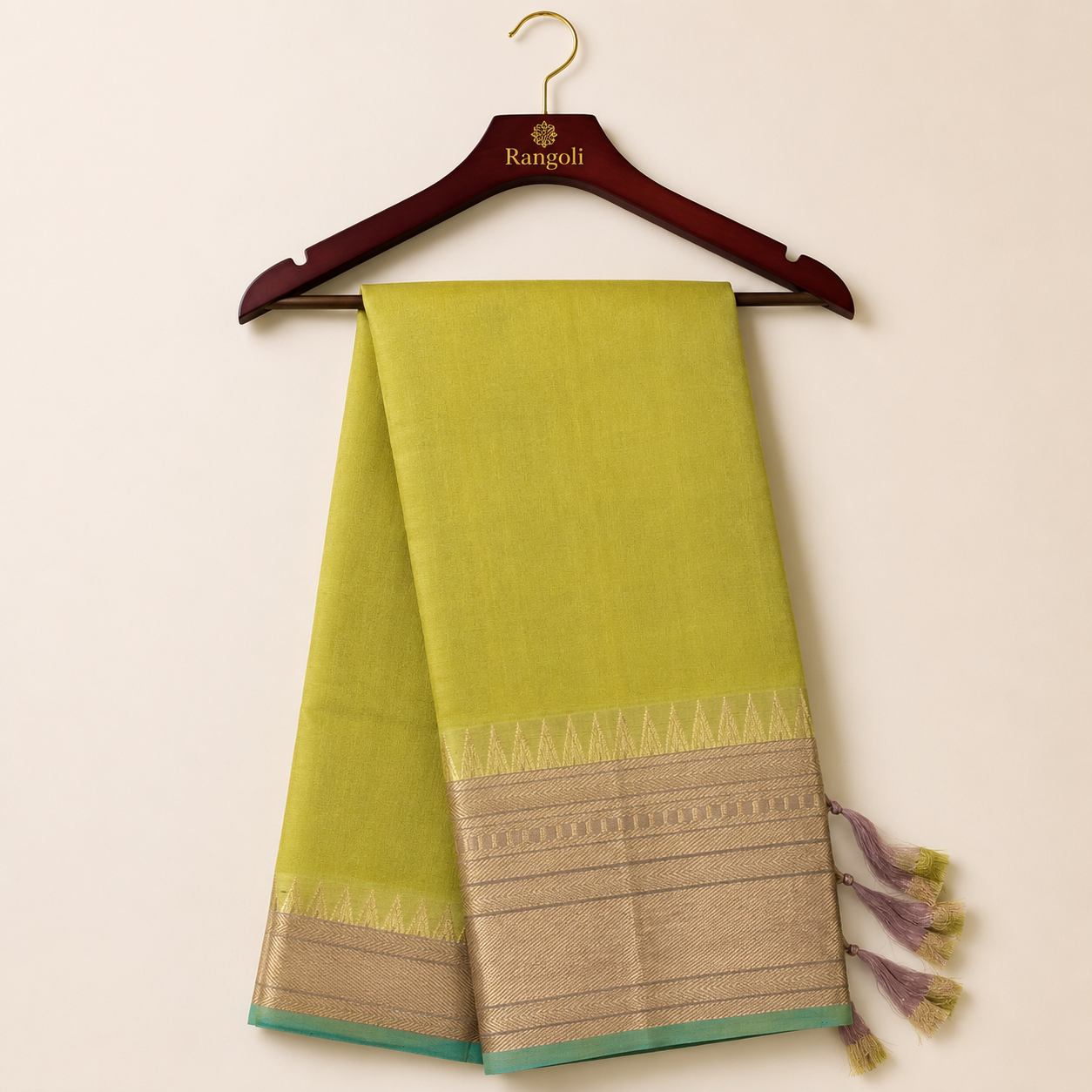 Elegant olive green silk saree featuring a rich gold zari border with a contrasting aqua blue edge for a graceful and timeless traditional look.