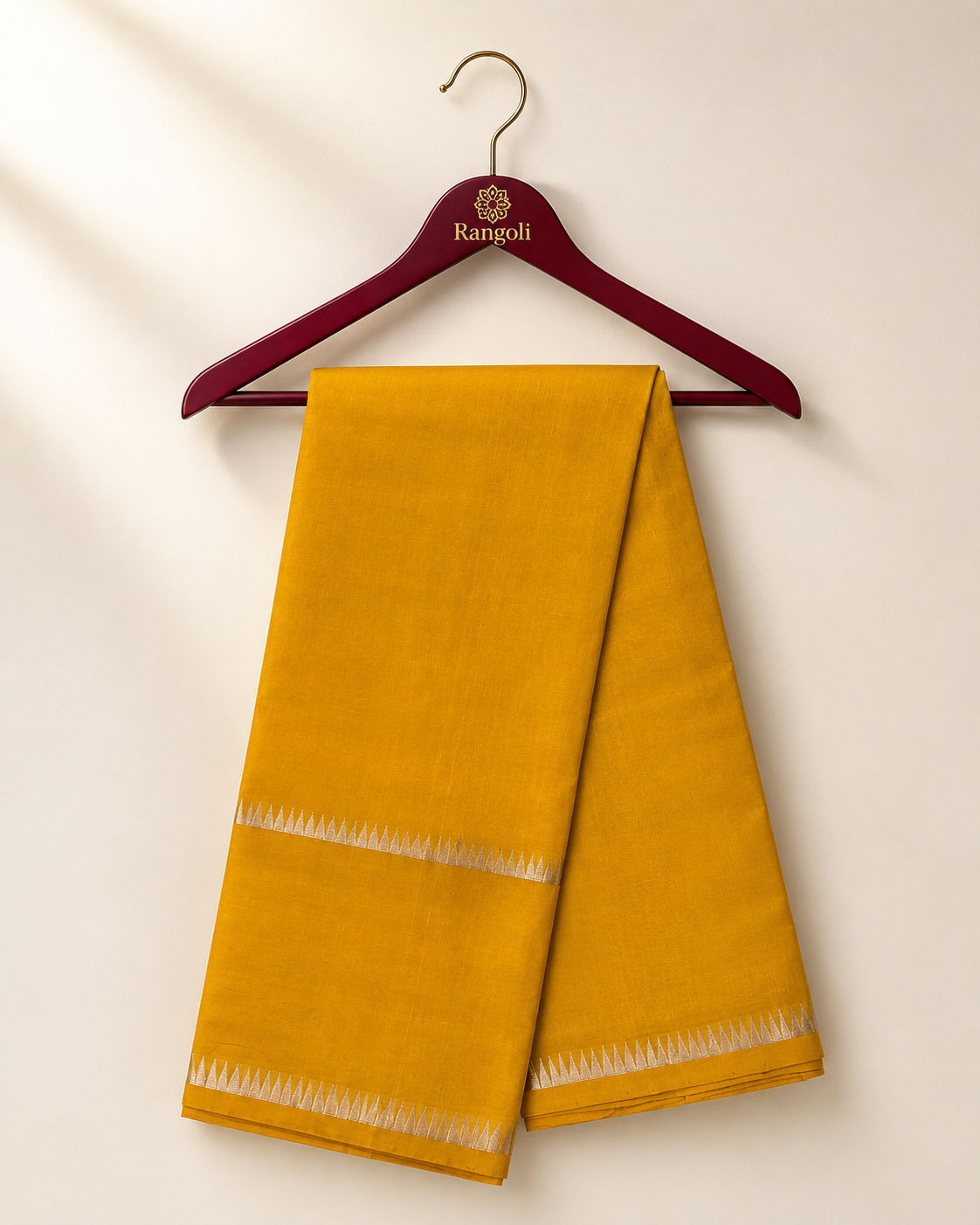 Grace your wardrobe with this timeless mustard yellow silk saree, beautifully accented by a subtle silver zari border for understated elegance.
