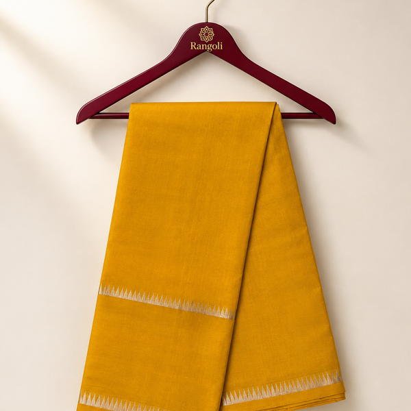 Grace your wardrobe with this timeless mustard yellow silk saree, beautifully accented by a subtle silver zari border for understated elegance.