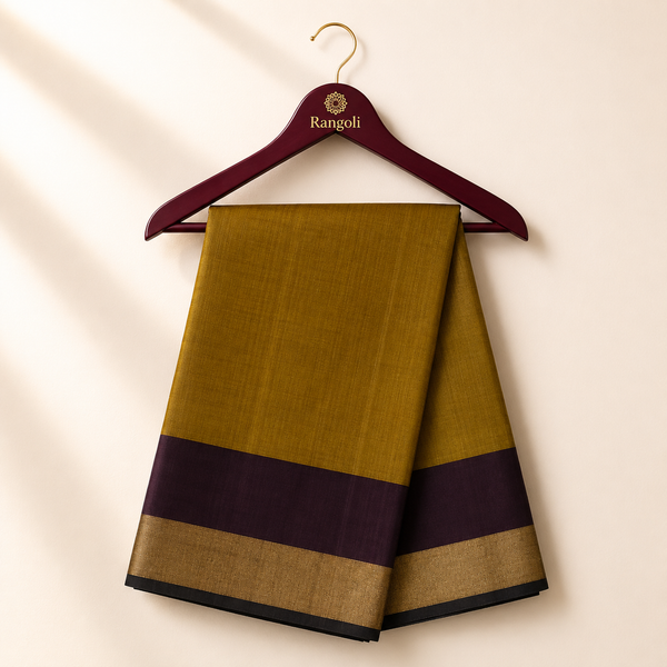 Elegant olive green silk saree featuring a rich chocolate brown border with a classic gold zari edge for timeless traditional sophistication.