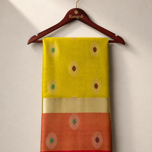 Radiate timeless elegance in this vibrant silk saree, adorned with delicate zari buttas and a rich contrasting zari border for a graceful traditional look.