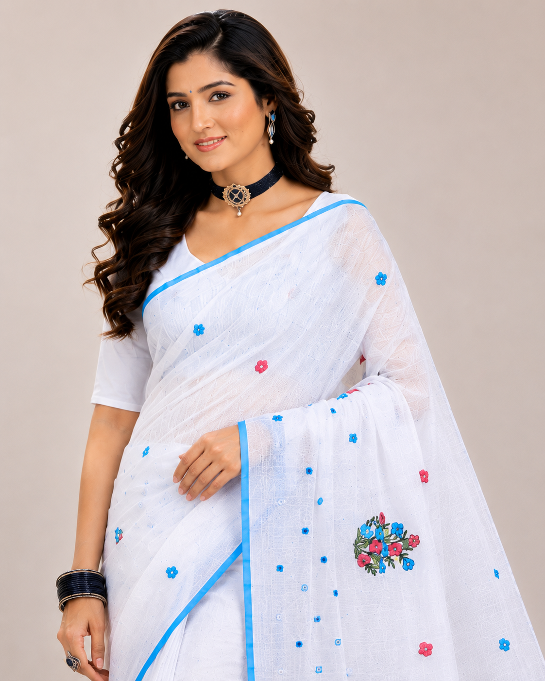 Elegant white saree featuring delicate floral embroidery and a refreshing sky-blue border for a graceful and timeless ethnic look.