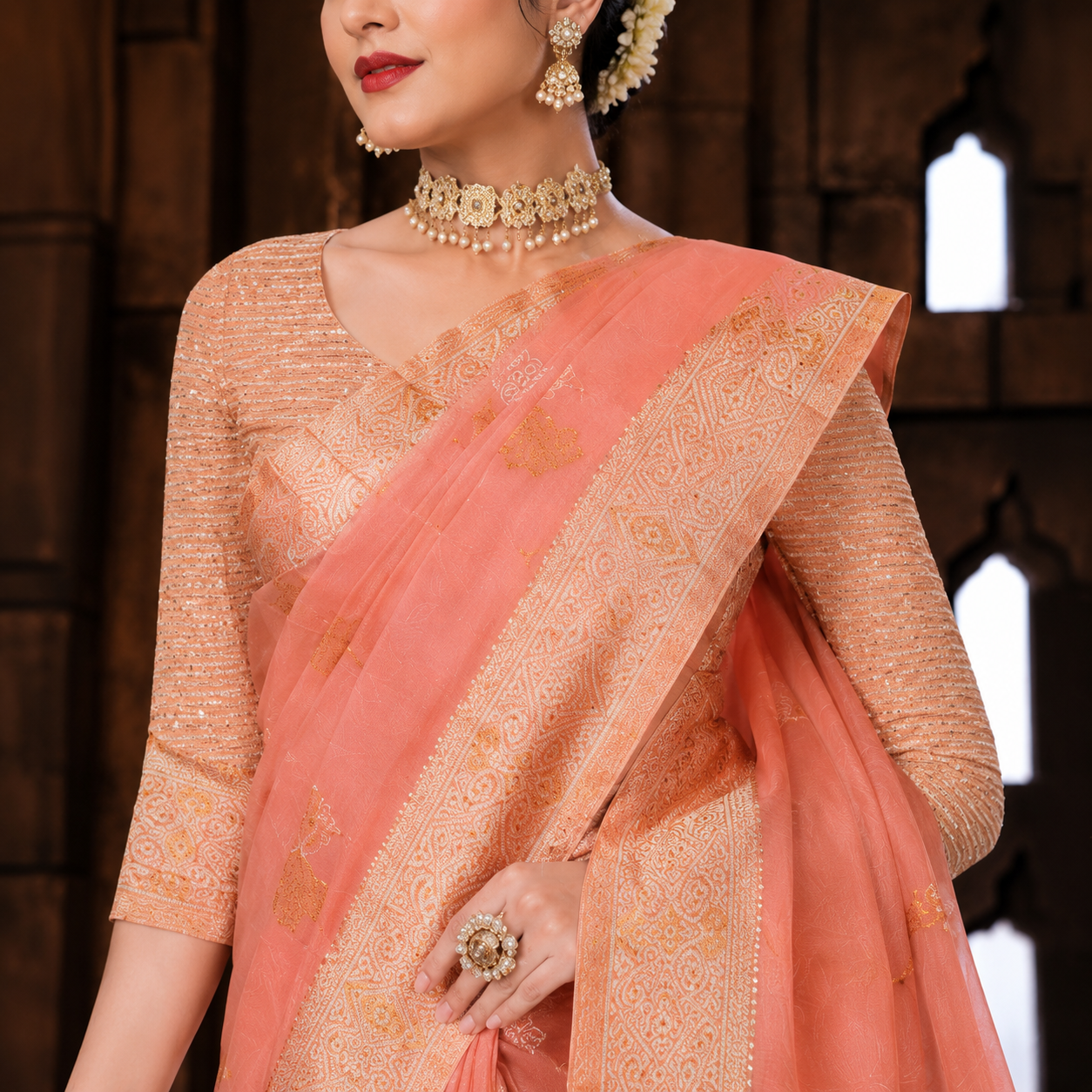Graceful peach Banarasi-style saree featuring intricate zari weaving and a richly detailed pallu for a regal festive look. ✨🧡