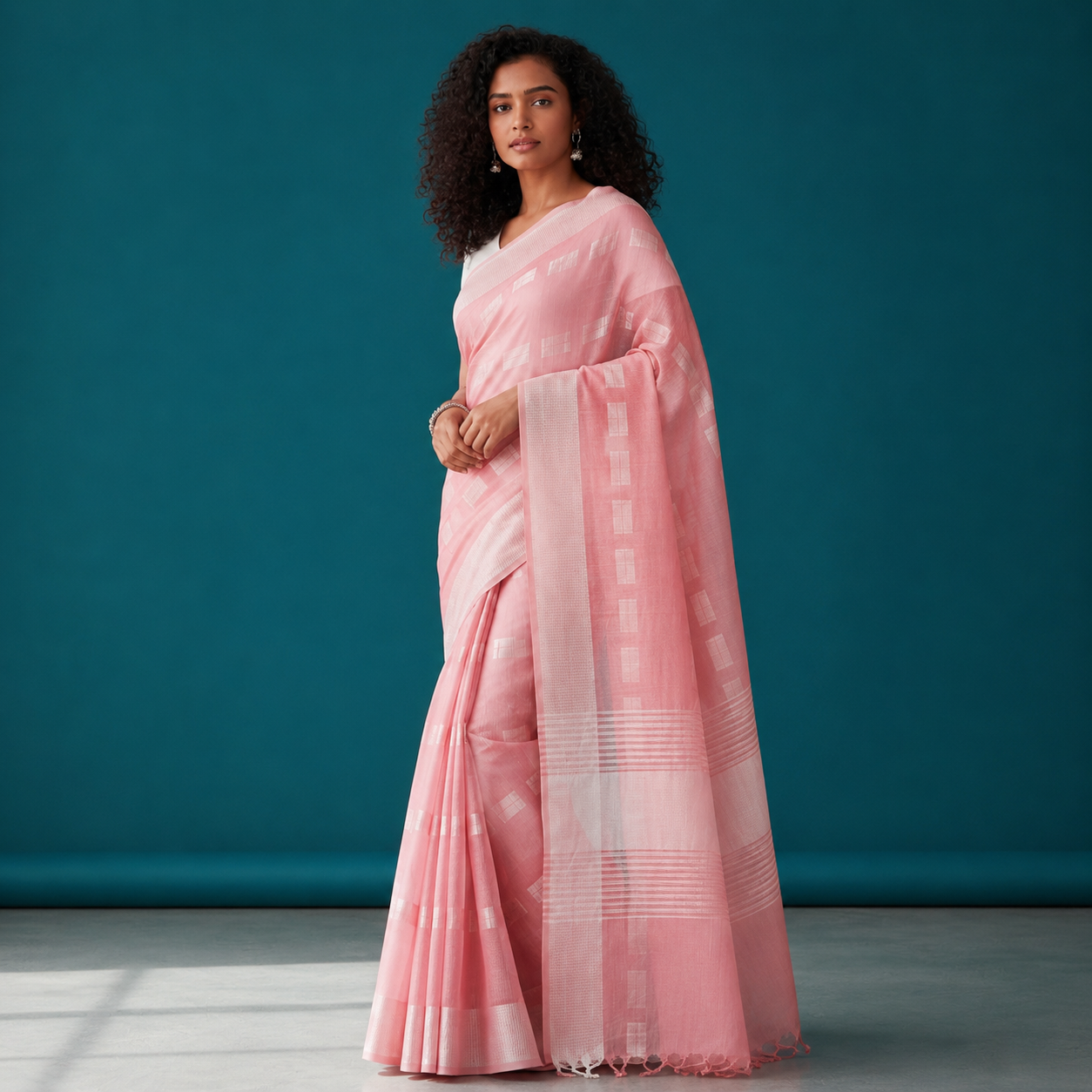 Elegant pastel pink cotton saree featuring subtle geometric woven motifs and a refined border for a graceful everyday ethnic look. 🌸✨