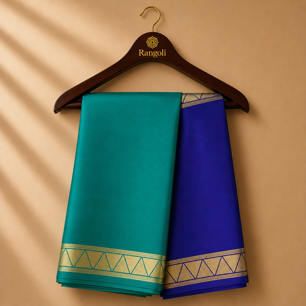 Teal and royal blue Mysore Silk saree featuring a striking dual-tone design with elegant geometric zari borders.