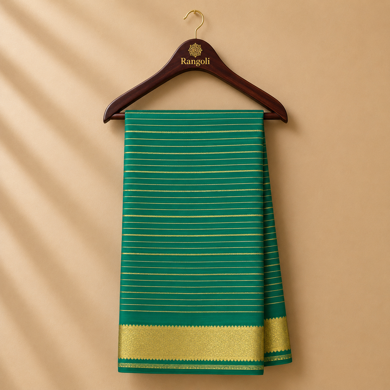 Bright green Mysore silk saree featuring delicate gold buttas across the body and a rich red-gold zari border for a timeless traditional look.