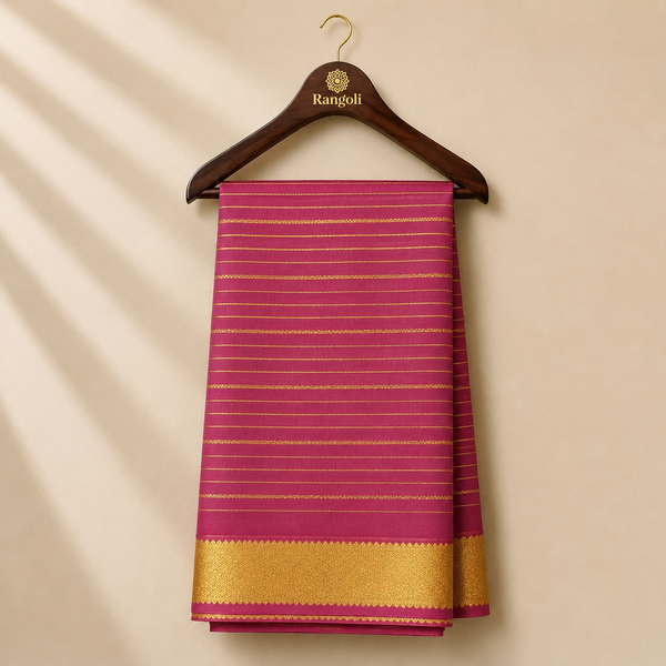Pink Mysore silk saree adorned with elegant gold zari stripes and a rich woven zari border for a graceful traditional look.