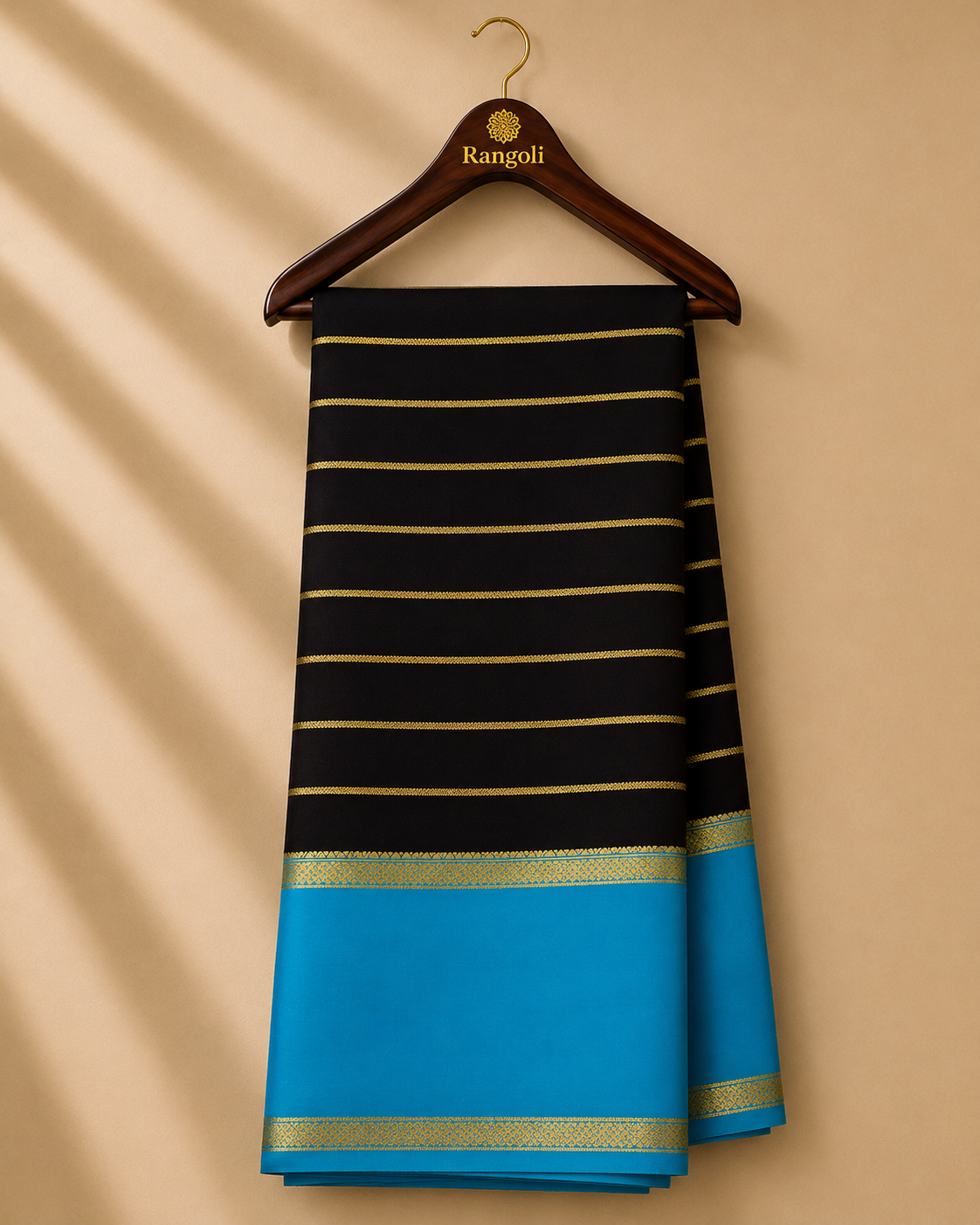 Elegant Mysore silk saree featuring classic gold zari stripes on a rich black body, complemented by a striking sky-blue contrast border.