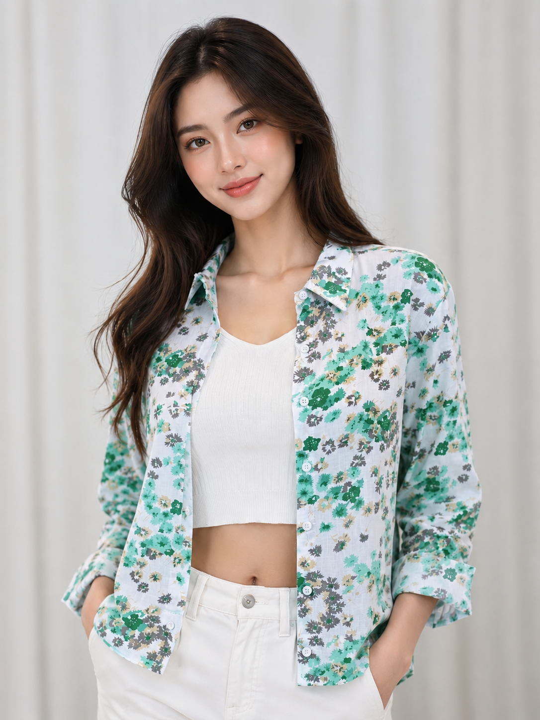 Fresh white floral shirt featuring soft green blooms, perfect for a chic and effortlessly stylish everyday look.