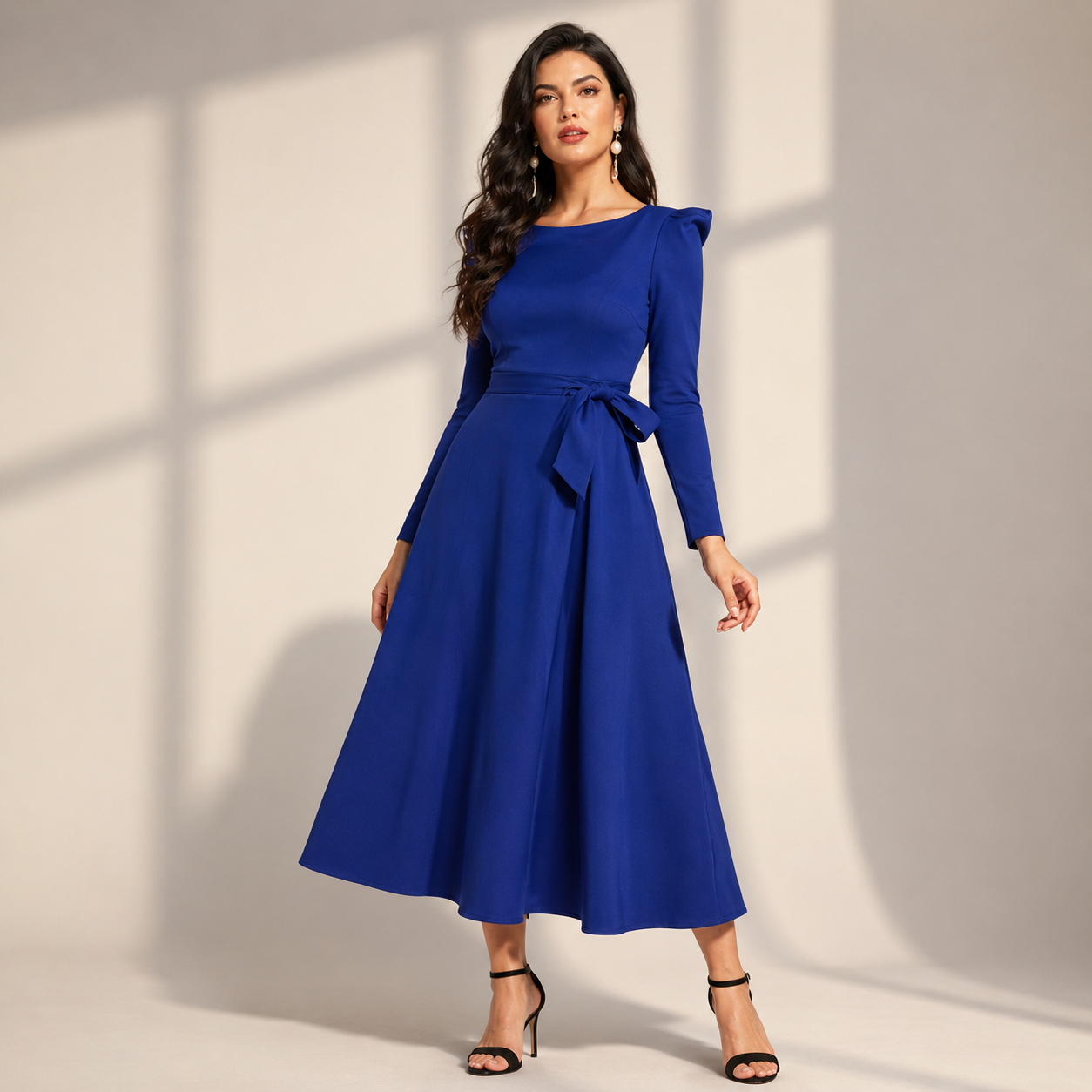 Elegant royal blue fit-and-flare midi dress with full sleeves and a chic waist-tie detail for a graceful party look.