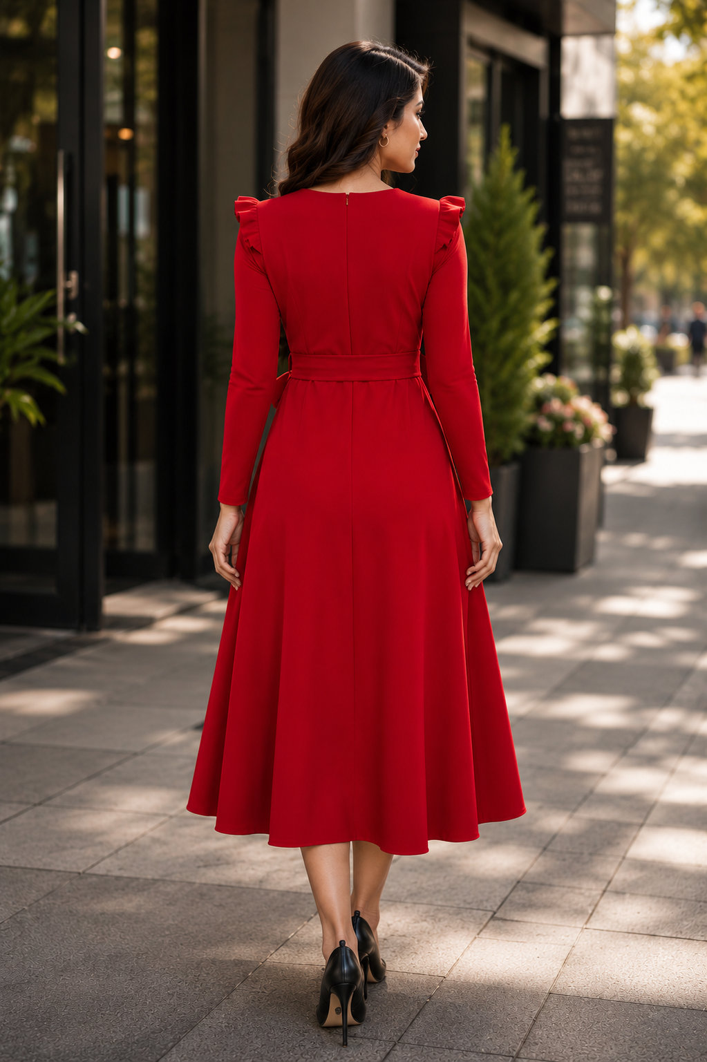 Elegant red A-line midi dress with a stylish waist tie detail and graceful feminine silhouette.