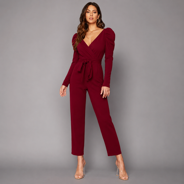 Elegant burgundy V-neck jumpsuit with puff sleeves and a sleek tailored silhouette for a sophisticated modern look.