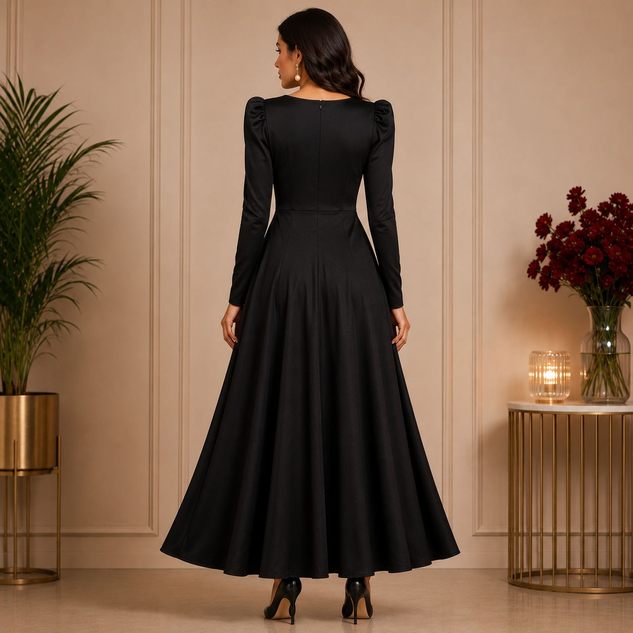 Elegant black maxi dress with statement shoulder detailing and a graceful flowy silhouette for a timeless sophisticated look.