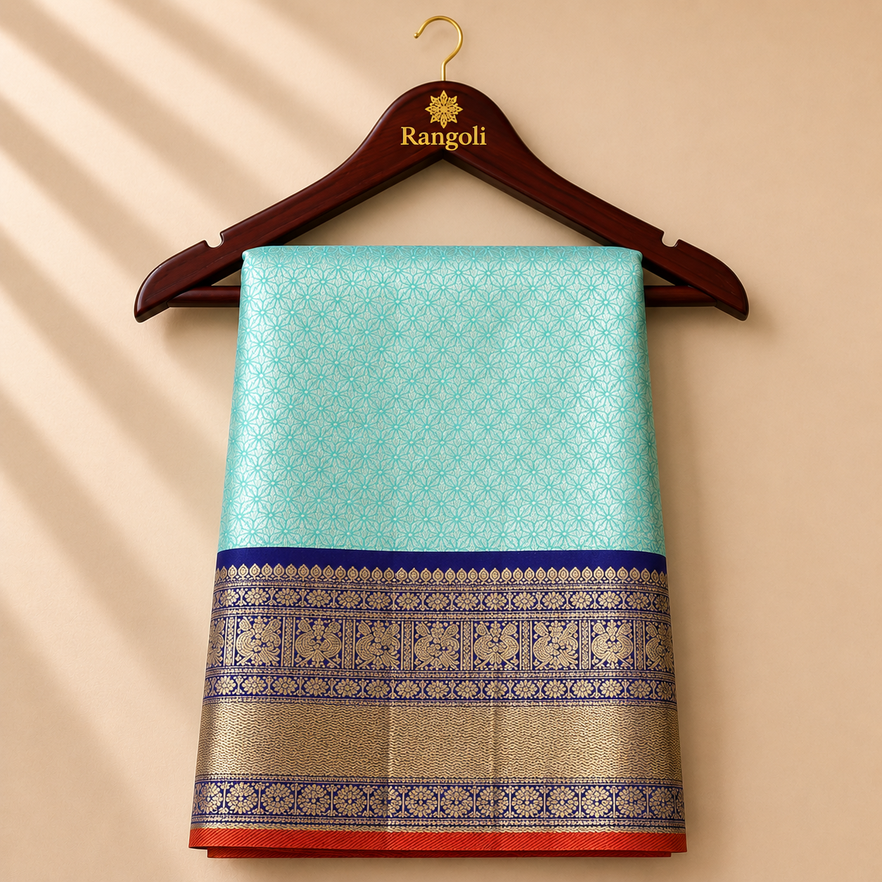 Kanchipattu seafoam green saree with intricate zari weaving and royal blue temple border.