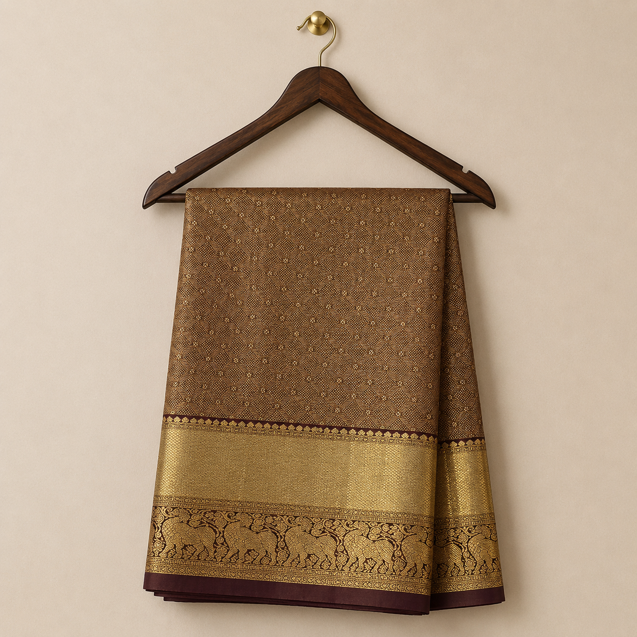 Elegant coffee brown Kanchipattu saree featuring intricate diamond zari weaving with a rich gold zari border and traditional elephant motifs.