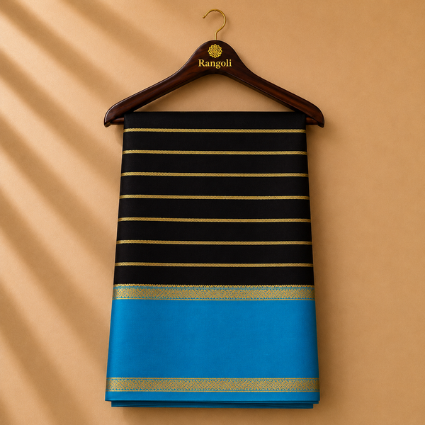 Elegant Mysore silk saree featuring classic gold zari stripes on a rich black body, complemented by a striking sky-blue contrast border.