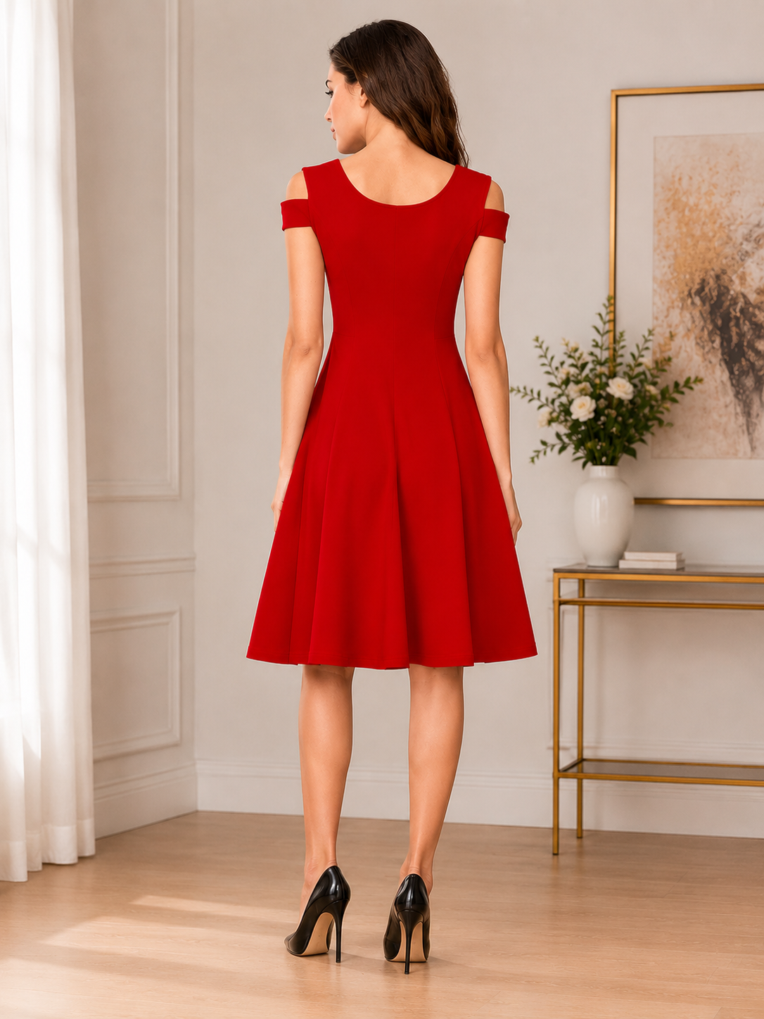 Elegant red fit-and-flare dress featuring a chic cold-shoulder neckline and graceful feminine silhouette.