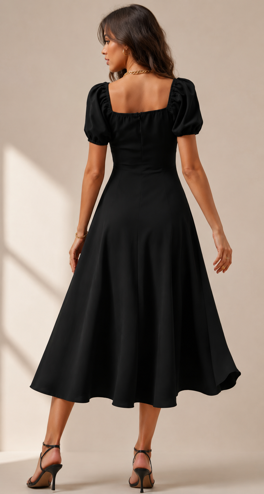 Elegant black slit midi dress with puff sleeves and a flattering flowy silhouette for a chic modern look.