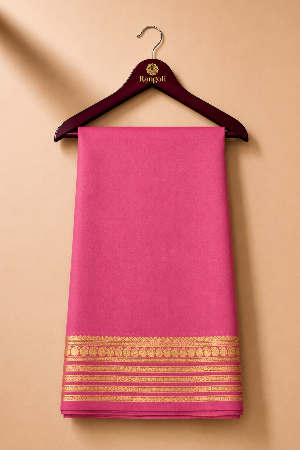Elegant rose-pink Mysore silk with a rich gold zari border featuring traditional paisley and floral motifs