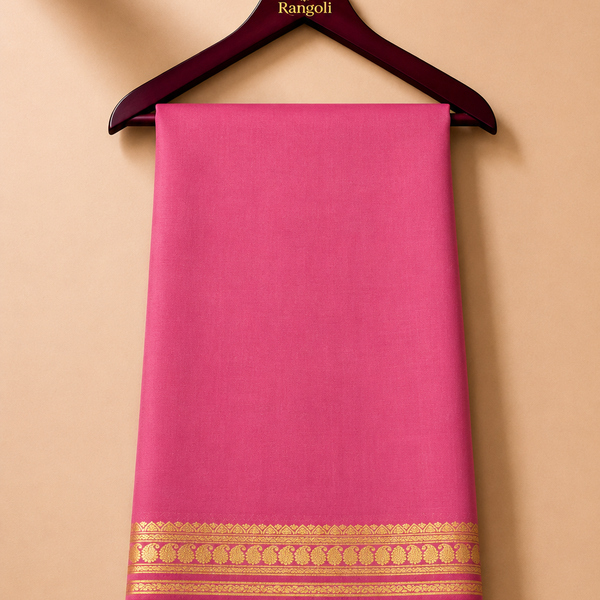 Elegant rose-pink Mysore silk with a rich gold zari border featuring traditional paisley and floral motifs